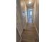 Hallway showcasing modern wood-look flooring connecting various rooms at 10890 W Evans Ave # 2E, Lakewood, CO 80227