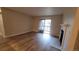 Cozy living area with a fireplace and sliding glass doors leading to a balcony at 10890 W Evans Ave # 2E, Lakewood, CO 80227