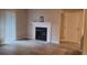 Bright living room featuring a fireplace, wood floors and sliding glass door at 10890 W Evans Ave # 2E, Lakewood, CO 80227