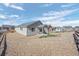 Backyard exterior view with zero-scape landscaping and a covered patio at 42338 Forest Oaks Dr, Elizabeth, CO 80107