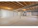 Spacious unfinished basement with concrete floors and exposed ceilings at 42338 Forest Oaks Dr, Elizabeth, CO 80107