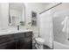 Updated bathroom with espresso vanity, white countertops, and tub with shower at 42338 Forest Oaks Dr, Elizabeth, CO 80107