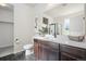 Modern bathroom featuring double sink vanity, sleek faucet, and shower with glass door at 42338 Forest Oaks Dr, Elizabeth, CO 80107