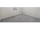 Cozy bedroom with neutral carpeting and a window offering natural light at 42338 Forest Oaks Dr, Elizabeth, CO 80107