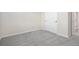 Empty bedroom featuring neutral carpet, base trim and double door closet at 42338 Forest Oaks Dr, Elizabeth, CO 80107