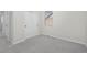Well-lit bedroom with gray carpet, white walls, and closet with white doors at 42338 Forest Oaks Dr, Elizabeth, CO 80107