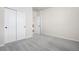 Neutral bedroom with gray carpet, white walls, and closet with white doors at 42338 Forest Oaks Dr, Elizabeth, CO 80107