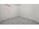 Minimalist bedroom with gray carpet, white walls, and window with blinds at 42338 Forest Oaks Dr, Elizabeth, CO 80107