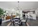 Dining area seamlessly connects to the living room and kitchen with a stylish chandelier at 42338 Forest Oaks Dr, Elizabeth, CO 80107