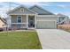 Charming single-Gathering home with a well-manicured lawn and a welcoming covered front porch at 42338 Forest Oaks Dr, Elizabeth, CO 80107