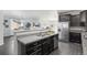 Open concept kitchen with granite countertops, stainless steel appliances, and dark wood cabinets at 42338 Forest Oaks Dr, Elizabeth, CO 80107
