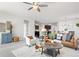 Bright living room with comfortable seating and a view of the adjacent dining area and kitchen at 42338 Forest Oaks Dr, Elizabeth, CO 80107