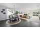 Open-concept living space with a dining area and a comfortable seating area at 42338 Forest Oaks Dr, Elizabeth, CO 80107