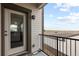Balcony with sliding glass door and metal railing overlooking the neighborhood at 4680 Copeland Loop # 204, Highlands Ranch, CO 80126