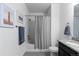 Bathroom featuring white walls, shower and tub combination, and framed artwork at 4680 Copeland Loop # 204, Highlands Ranch, CO 80126