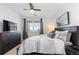 Comfortable bedroom with a large bed, dresser, and view from the window at 4680 Copeland Loop # 204, Highlands Ranch, CO 80126