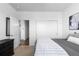 Bedroom featuring neutral walls, carpet, closet, and doorway to hallway and additional rooms at 4680 Copeland Loop # 204, Highlands Ranch, CO 80126