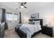 Bright bedroom featuring a comfortable bed, nightstands, and a window at 4680 Copeland Loop # 204, Highlands Ranch, CO 80126
