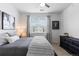 Bright bedroom with window and blinds, modern decor, neutral walls, and comfy bedding at 4680 Copeland Loop # 204, Highlands Ranch, CO 80126