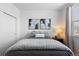 Clean bedroom with neutral walls, comfy bedding, stylish decor, and window with lots of natural light at 4680 Copeland Loop # 204, Highlands Ranch, CO 80126