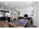 Open-concept living area with seamless flow between dining room, kitchen, and living room spaces at 4680 Copeland Loop # 204, Highlands Ranch, CO 80126