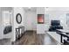 Bright entryway with wood floors, modern decor, and an open view into the living spaces at 4680 Copeland Loop # 204, Highlands Ranch, CO 80126