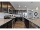 Contemporary kitchen with stainless steel appliances and a granite-topped island at 4680 Copeland Loop # 204, Highlands Ranch, CO 80126
