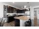 Kitchen area showcasing stainless steel appliances, granite countertops, and dark cabinetry at 4680 Copeland Loop # 204, Highlands Ranch, CO 80126