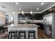 Well-equipped kitchen boasting stainless steel appliances, granite countertops, and a large island with seating at 4680 Copeland Loop # 204, Highlands Ranch, CO 80126