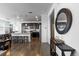 Open-concept living space with hardwood floors, dark cabinetry, and stylish decor at 4680 Copeland Loop # 204, Highlands Ranch, CO 80126