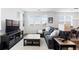 Comfortable living room with large windows, plush sofa, stylish decor, and ample natural light at 4680 Copeland Loop # 204, Highlands Ranch, CO 80126