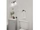 Modern bathroom featuring white subway tile, sleek fixtures, and a clean, minimalist design at 2405 W 39Th Ave, Denver, CO 80211