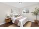 Cozy bedroom with a comfortable bed, stylish decor, and ample natural light from the window at 2405 W 39Th Ave, Denver, CO 80211