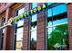 Exterior of CorePower Yoga featuring large windows and signage, highlighting a fitness center location at 2405 W 39Th Ave, Denver, CO 80211
