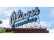 Vintage Olinger Mortuaries sign against a clear sky, showcasing a historical landmark at 2405 W 39Th Ave, Denver, CO 80211
