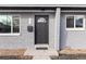 Inviting front entrance with stylish gray brick, updated windows, and door at 2405 W 39Th Ave, Denver, CO 80211