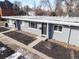 Contemporary exterior showcases a gray brick facade with manicured landscaping at 2405 W 39Th Ave, Denver, CO 80211