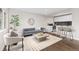 Comfortable living area with hardwood floors and ample natural light at 2405 W 39Th Ave, Denver, CO 80211