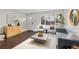 Spacious living area with hardwood floors, bright windows, and stylish decor at 2405 W 39Th Ave, Denver, CO 80211