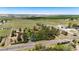 Scenic aerial shot of the property, showcasing a peaceful setting near a quiet road at 2965 Wagner St, Strasburg, CO 80136