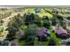 Aerial view of home with log cabin guest house on lush green property at 2965 Wagner St, Strasburg, CO 80136
