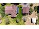 Aerial view of the property with the home, greenhouse, additional building, and woodpile at 2965 Wagner St, Strasburg, CO 80136