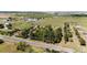 Picturesque aerial view highlighting the property's peaceful setting with vast farmland views at 2965 Wagner St, Strasburg, CO 80136