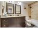 Bathroom features a double sink vanity and shower over tub at 120 S Pennsylvania St # 302, Denver, CO 80209