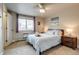 Bright bedroom with a ceiling fan, and a nightstand at 120 S Pennsylvania St # 302, Denver, CO 80209