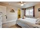 Comfortable bedroom with a window view, closet, neutral tones, and a ceiling fan at 120 S Pennsylvania St # 302, Denver, CO 80209