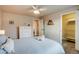 Bedroom featuring neutral colors, a ceiling fan, and an adjacent closet with wire shelving at 120 S Pennsylvania St # 302, Denver, CO 80209