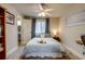 Comfortable bedroom with a ceiling fan and closet at 120 S Pennsylvania St # 302, Denver, CO 80209
