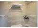 Bright closet with installed white wire shelving for optimal storage, hangers, and a pillow at 120 S Pennsylvania St # 302, Denver, CO 80209