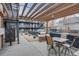 Community outdoor area with modern seating, a grill, and decorative rock landscaping at 120 S Pennsylvania St # 302, Denver, CO 80209